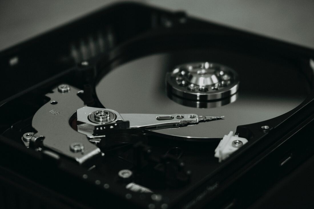 Black and silver hard disk drive.